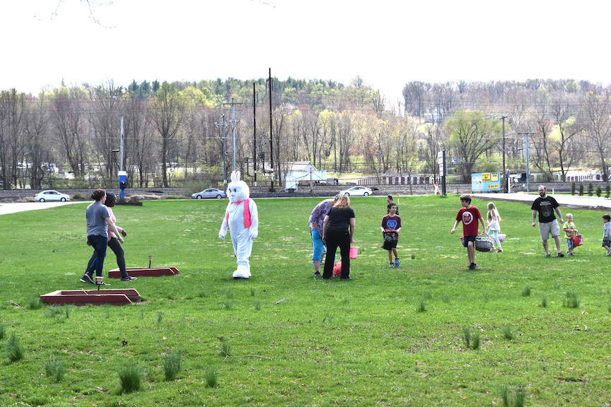 Children gather plastic eggs on the lawn of Post 845. 4/13/19.